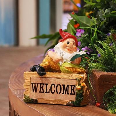 Farmhouse Elf Reading Resin Ground Lamp Portable Solar LED Pathway Light in Yellow
