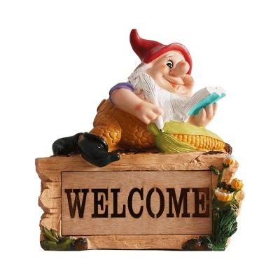 Farmhouse Elf Reading Resin Ground Lamp Portable Solar LED Pathway Light in Yellow