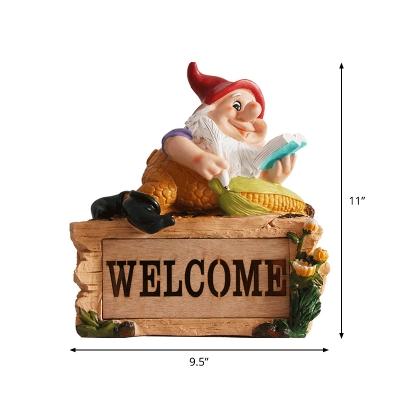 Farmhouse Elf Reading Resin Ground Lamp Portable Solar LED Pathway Light in Yellow