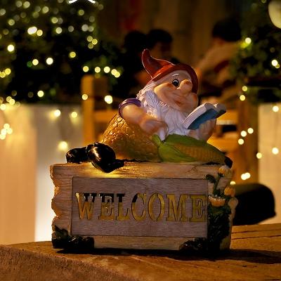 Farmhouse Elf Reading Resin Ground Lamp Portable Solar LED Pathway Light in Yellow